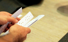 Load image into Gallery viewer, Handmade Kambo burning stencils with durable plastic sheets, ring-bound and enclosed in soft wooden paneling
