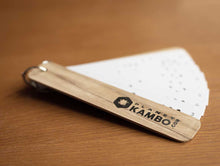 Load image into Gallery viewer, Handmade Kambo burning stencils with durable plastic sheets, ring-bound and enclosed in soft wooden paneling
